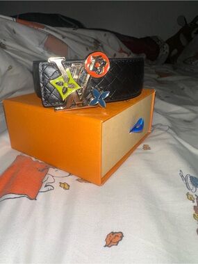 Black Louis Vuitton belt colorful gold buckle